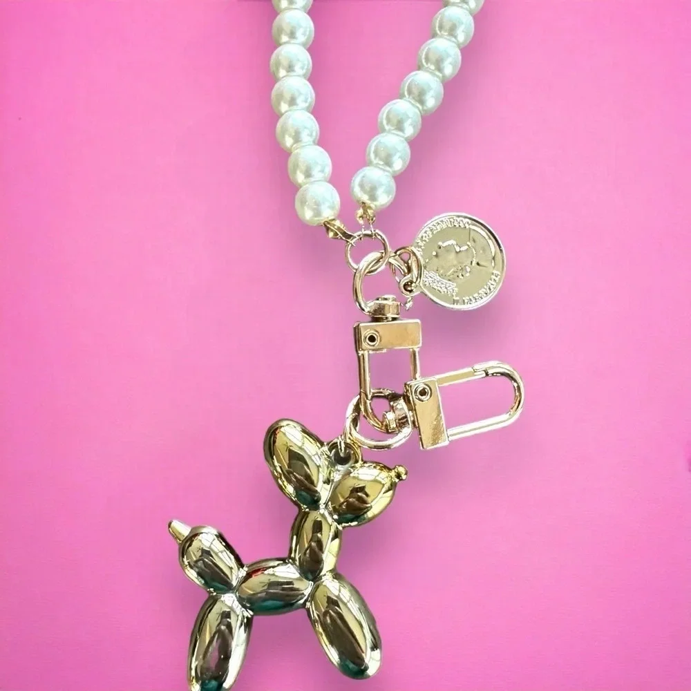 Balloon dog gold keychain with‎ pearl accent